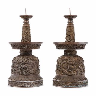 A Pair of Chinese Bronze Candle Holders