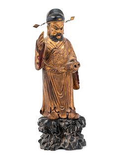 A Chinese Gilt Decorated Wood Figure of a Standing Official