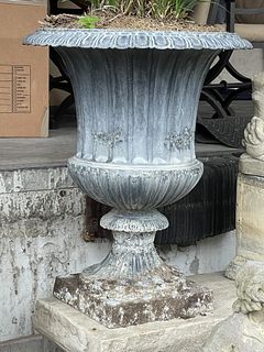 PAIR OF OUTDOOR CAST IRON URN PLANTERS