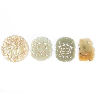 FOUR CHINESE CARVED HARDSTONE PENDANTS