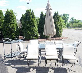 Eleven Piece Outdoor Patio Set, to include eight iron chairs with cushions, a glass top table, umbrella and a two tier cart, top 43" x 81".