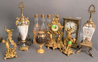 Eight Piece Lot, to include a blue and gilt decorated Faberge egg, a pair of gilt brass candlesticks having putti forms, a brass clock with puttis, a 