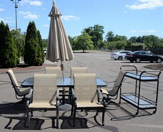 Nine Piece Outdoor Patio Set, to include six armchairs, a glass top table, umbrella and a bar cart, top 43" x 81".