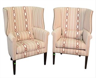 Pair of Edward Ferrell Upholstered Wing Chairs, along with bolster pillows, height 45 inches, width 30 inches.