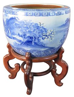 Chinese Blue and White Planter, having a pagoda on a river scene, on hardwood stand, height 13 inches, diameter 17 3/4 inches.
