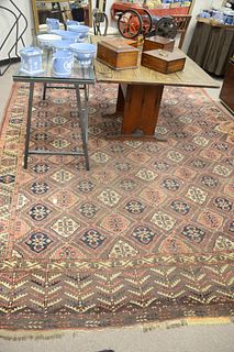 Bokara Oriental Carpet, 8' 8" x 12' 9", (side fraying, one tear in field).