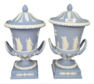 Pair of Wedgwood Jasperware Lidded Urns, light blue ground with figures, height 12 inches.