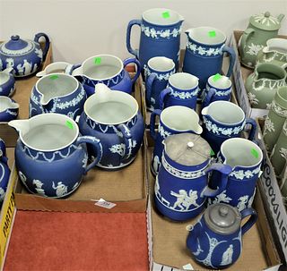 Fifteen Blue Wedgwood Jasperware Pitchers, having classical figures, two marked 1636, tallest pitcher 8 1/4 inches.