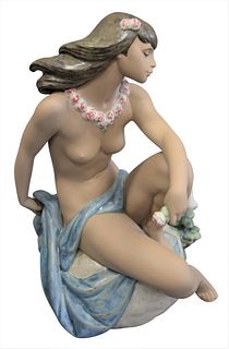 Lladro Porcelain Hawaiian Girl Figure, wearing a lei and sitting with a dove, marked to the underside, height 14 inches.