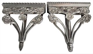 Pair of Ebonized Carved Wood Wall Brackets, having floral design, height 17 inches, width 16 3/4 inches.