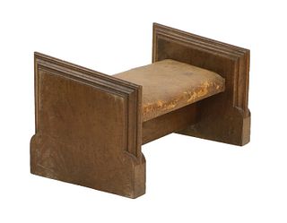 An ecclesiastical oak and leather kneeler,