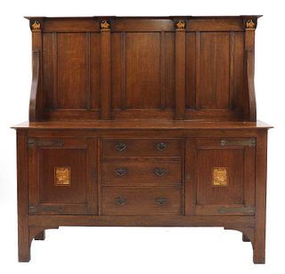 A rare Arts and Crafts oak and inlaid sideboard,