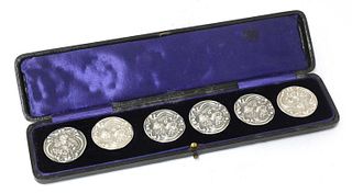 A cased set of six Art Nouveau silver buttons,