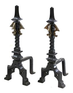 A pair of Arts and Crafts wrought iron and bronze firedogs,