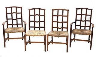 A set of four Arts and Crafts oak lattice back chairs,