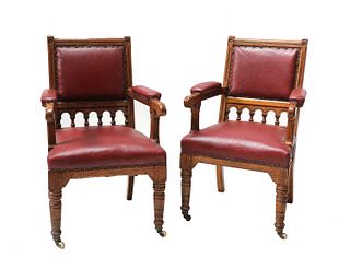 A pair of oak library armchairs,