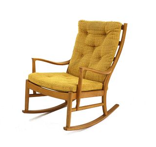A Parker Knoll beechwood rocking chair,