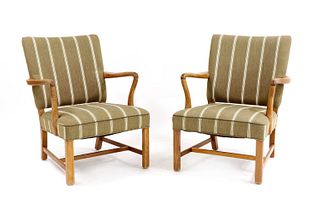 A pair of Danish oak-framed lounge chairs,
