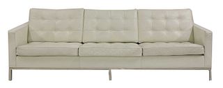 A modern 'Relax'-style white leather sofa,