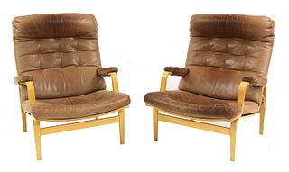 A pair of 'Ingrid' armchairs,