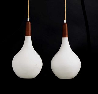 A pair of Scandinavian teak-mounted pendant lights,