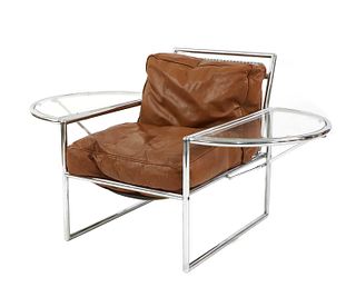 A chrome and tan leather armchair,