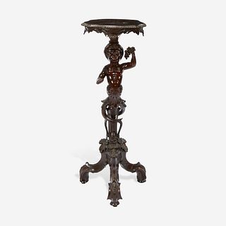 A George II Carved Mahogany Figural Tripod Table First half 18th century