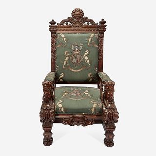 A Large Carved Renaissance Revival Throne Chair Upholstered in Armorial Fabric