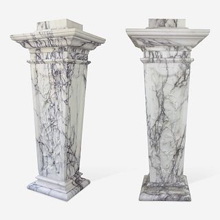 A Large Pair of Variegated White Marble Pedestals*