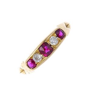 An early 20th century 18ct gold ruby and diamond five-stone ring. The alternating cushion-shape ruby