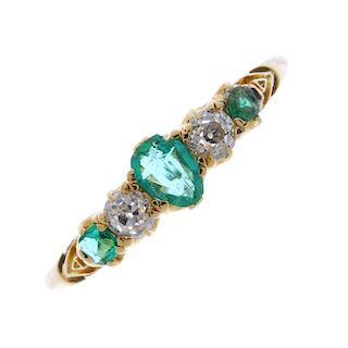 An early 20th century 18ct gold emerald and diamond ring. The pear-shape emerald, to the graduated o