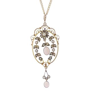 An early 20th century 9ct gold opal and split pearl pendant. The oval-opal cabochon drops, within a