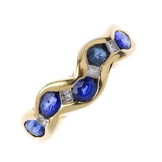 An 18ct gold sapphire and diamond dress ring. The oval-shape sapphire undulating line, with square-s