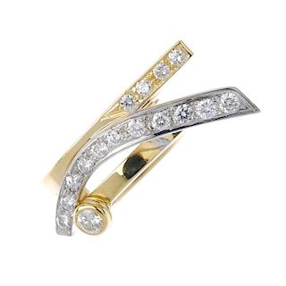 An 18ct gold diamond dress ring. Of abstract design, the brilliant-cut diamond collet, to the pave-s