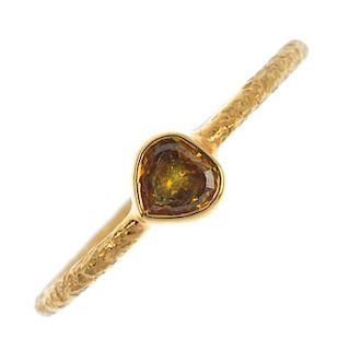 * A coloured diamond single-stone ring. The heart-shape 'yellowish orange' diamond collet, to the te