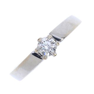 A diamond single-stone ring. The brilliant-cut diamond, to the plain band. Estimated diamond weight