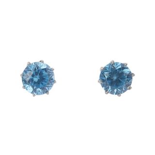 Two pairs of gem-set ear studs. A pair of circular-shape blue zircon ear studs and a pair of freshwa