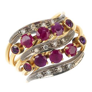 A ruby and diamond dress ring. Designed as an alternating series of circular-shape ruby and brillian