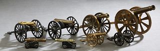 Group of Eight Miniature Cannons, 20th c., on caissons, consisting of three brass examples, four brass and iron examples, and one iron example, Larges