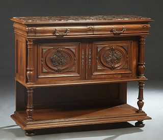 French Henri II Style Carved Walnut Marble Top Server, late 19th c., the inset highly figured rouge marble over double frieze drawers above setback ag