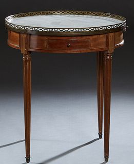 French Louis XVI Style Carved Mahogany Marble Top Gueridon, 20th c., the pierced brass galleried circular white figural marble over a wide skirt with 