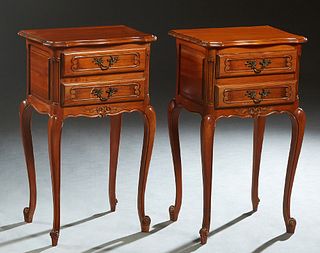Pair of French Louis XV Style Carved Cherry Nightstands, 19th c., the stepped bowed top over a bank of two drawers, on cabriole legs with scrolled toe