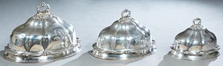 Set of Three Sheffield Silverplated Graduated Meat Domes, late 19th c., by William and George Sissons, of shaped lobed form, with relief acorn and scr