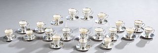 Assembled Set of Twenty Sterling Demitasse Cups and Saucers 20th c., with nineteen assorted matching porcelain liners, consisting of eight by Dominick
