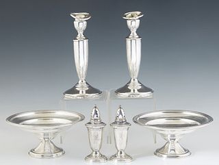 Group of Six Weighted Sterling Items, 20th c., consisting of a pair of compotes, a pair of candlesticks, and a pair of salt and pepper shakers. (6 Pcs
