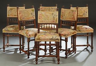 Set of Six French Carved Walnut Henri II Style Dining Chairs, c. 1880, the lion carved back over an upholstered panel and a spindled frieze, to an uph