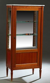 French Louis XVI Style Carved Mahogany Marble Top Vitrine, 20th c., the ogee edge cookie corner white marble over a center door with a glazed upper pa