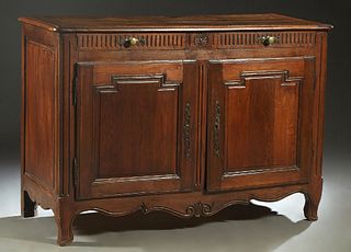 French Provincial Louis XV Style Carved Walnut Sideboard, 19th c., the rounded corner top over two reeded frieze drawers above double fielded panel cu