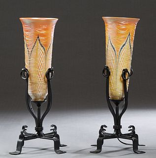 Pair of Art Glass and Iron Torchere Table Lamps, 20th., with tapered gold luster trumpet shades with painted leaf and applied gold thread decoration, 
