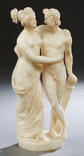 Italian School, "Venus and Adonis," late 19th c., carved marble group, possibly a Grand Tour souvenir, on an integral circular base, H.- 18 in., W.- 8